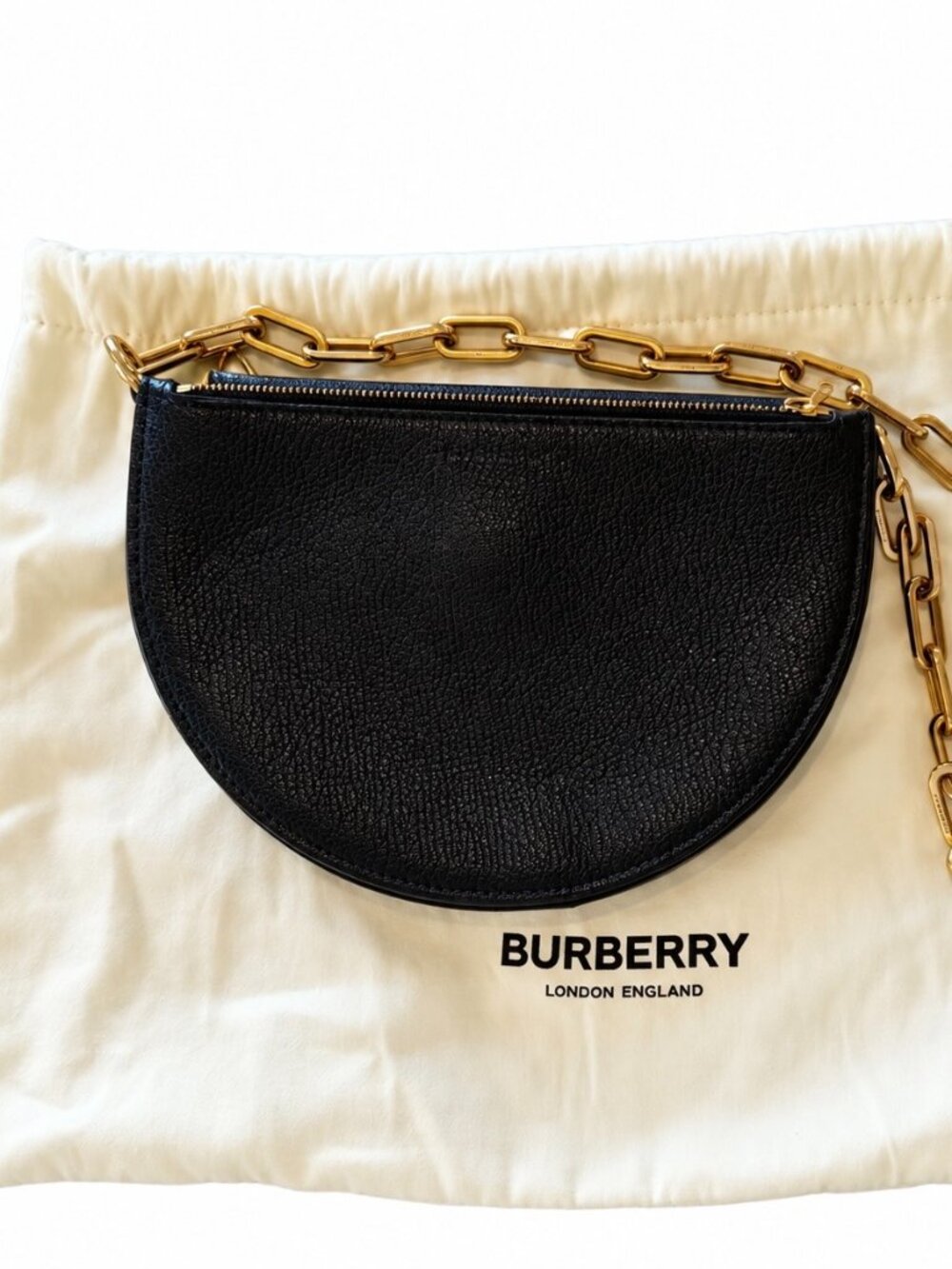 Burberry black leather mini bag with gold tone chain and zip hardware